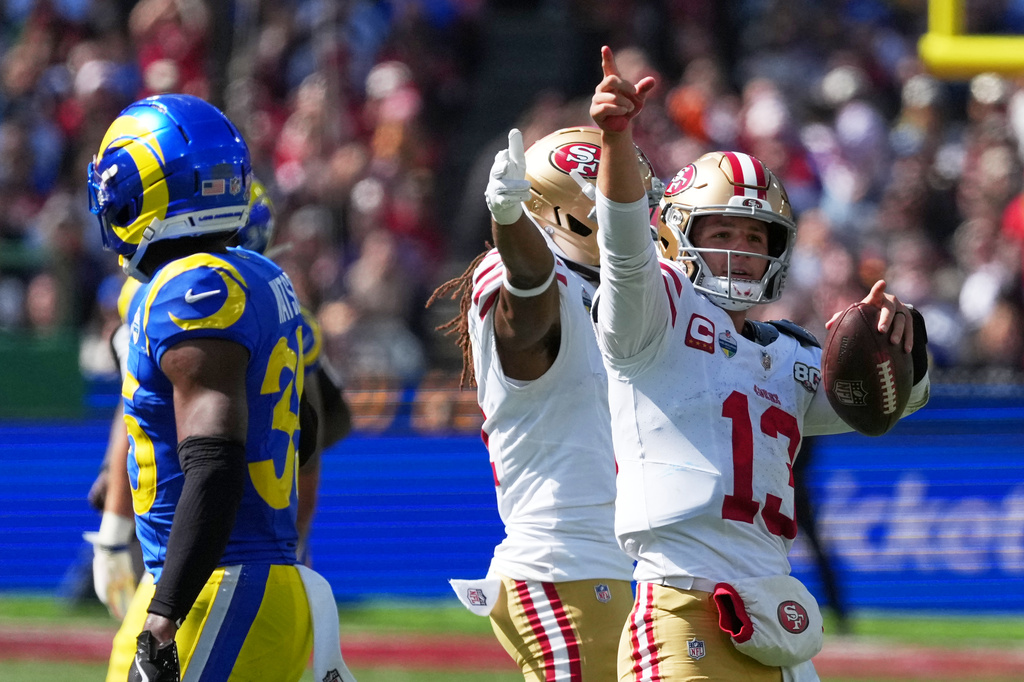 San Francisco 49ers quarterback Brock Purdy celebrates after a runs against the Los Angeles Rams during the second half of an NFL football game, Friday, Sept. 11, 2026, in Melbourne, Australia. (AP Photo/Asanka Brendon Ratnayake)