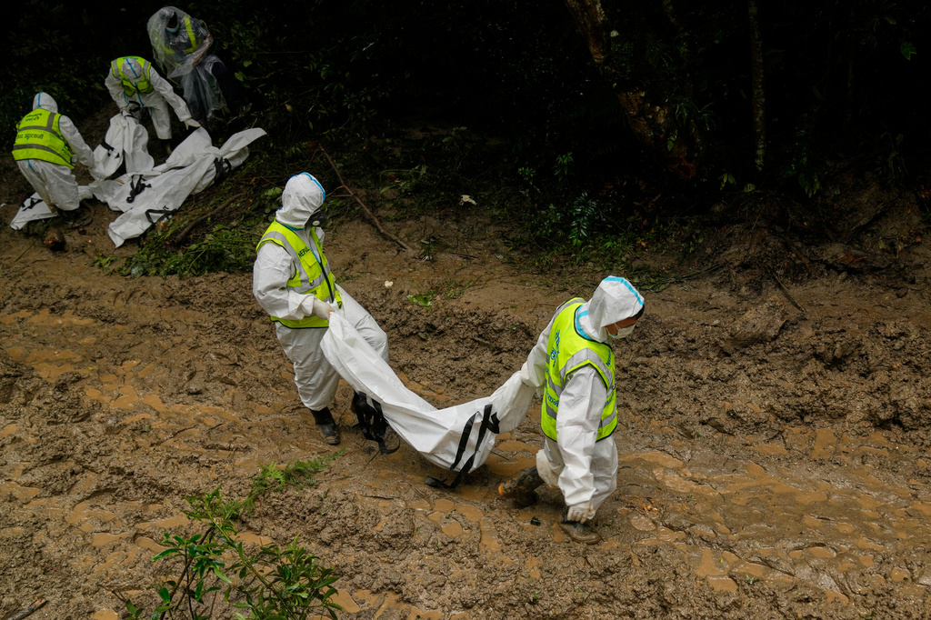 FILE - Nepal police personnel prepare the bodies of flash flood victims for a mass burial in Kathmandu, Nepal, Sept. 1, 2026. (AP Photo/Dar Yasin, File)