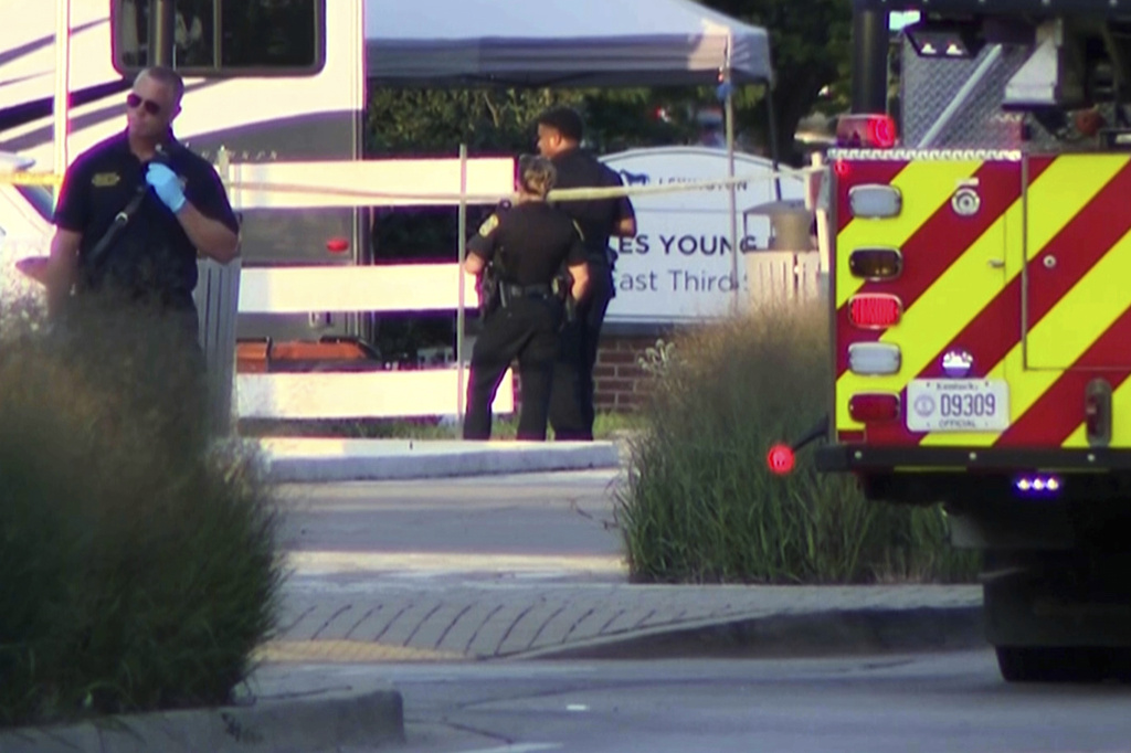 This image taken from video and provided by WTVQ shows officers at the scene of a shooting at Charles Young Park in Lexington, Ky., Saturday, Aug. 15, 2026. (WTVQ via AP)