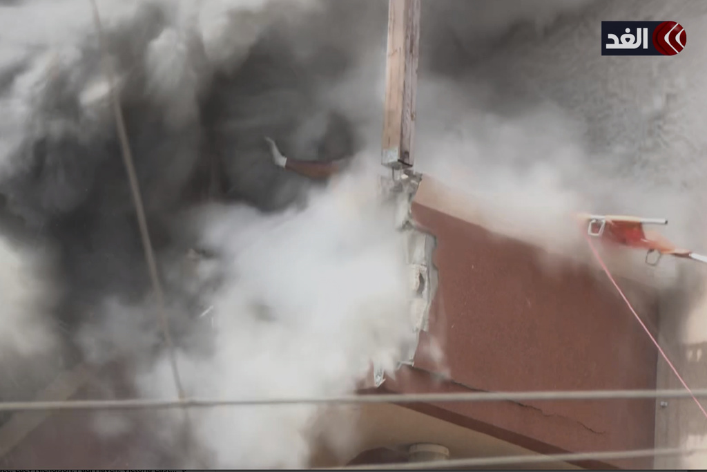 This frame grab taken from a video released by Al Ghad TV shows the second of two rounds of Israeli strikes hitting the outside stairs of Nasser Hospital, minutes after the first, in Khan Younis, southern Gaza Strip, Monday, Aug. 25, 2025. (Al Ghad TV via AP)