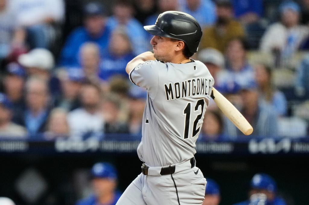 Chicago White Sox's Colson Montgomery watches his RBI double during the fourth inning of a baseball game against the Kansas City Royals, Thursday, April 9, 2026, in Kansas City, Mo. (AP Photo/Charlie Riedel)
