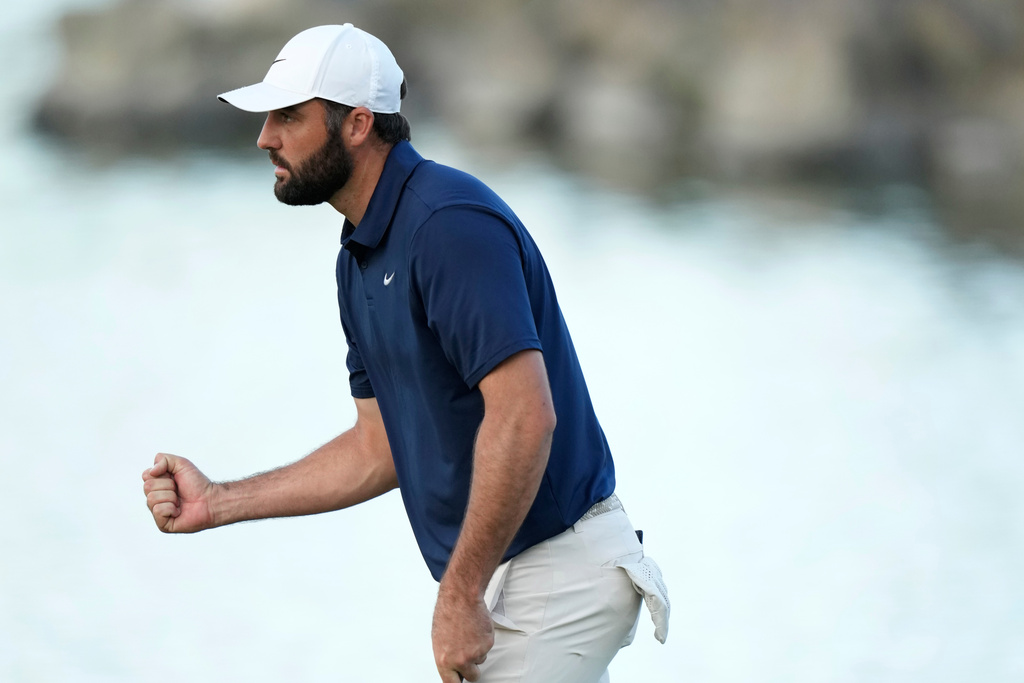 Scottie Scheffler pumps his fist after making a par on the 18th hole during the third round of the American Express golf event on the Pete Dye Stadium Course at PGA West Saturday, Jan. 24, 2026, in La Quinta, Calif. (AP Photo/Ross D. Franklin)