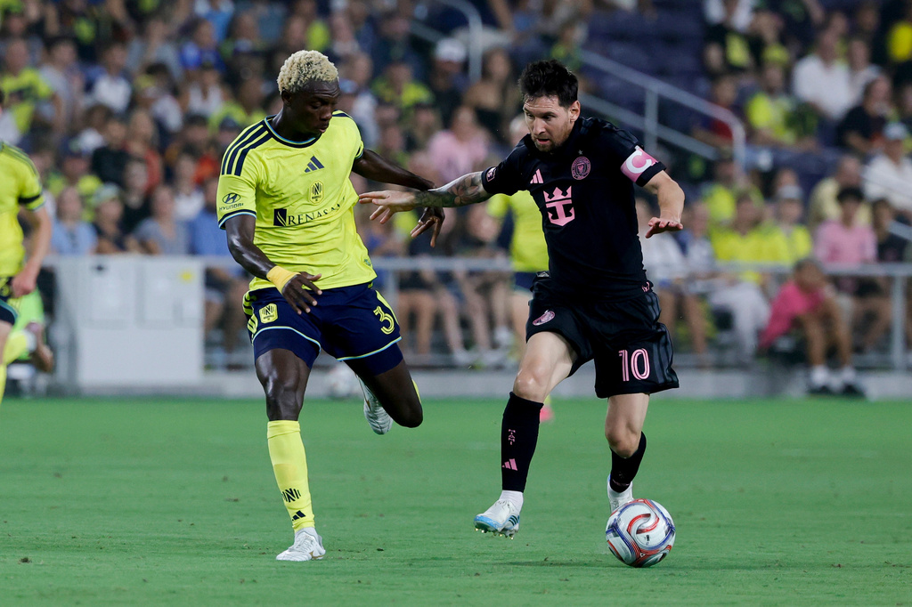 Inter Miami CF offense Lionel Messi (10) dribbles the ball as Nashville SC defense Andy Nájar (31) defends during the first half of an MLS soccer match Saturday, Aug. 15, 2026, in Nashville, Tenn. (AP Photo/Butch Dill)