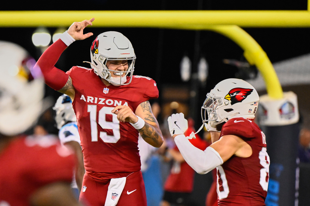 Arizona Cardinals quarterback Carson Beck (19) and wide receiver Simi Fehoko, right, celebrate after Beck threw a touchdown pass to Fehoko in the first half of the Pro Football Hall of Fame NFL preseason game in Canton, Ohio, Thursday, Aug. 6, 2026. (AP Photo/David Richard)