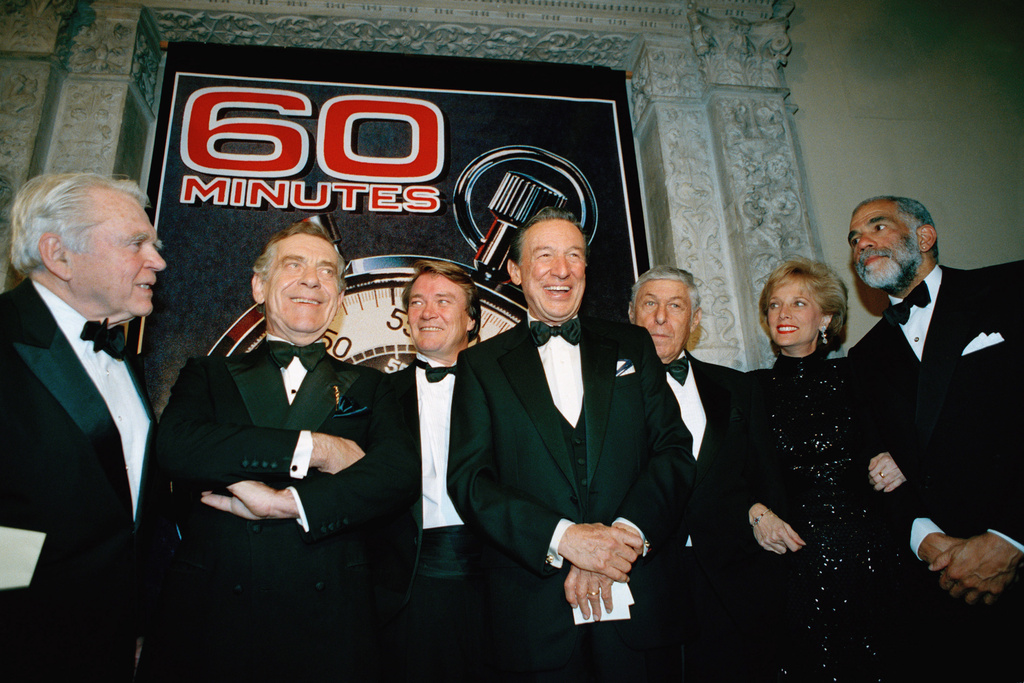 FILE - The "60 Minutes" team, from left, Andy Rooney, Morley Safer, Steve Kroft, Mike Wallace, executive producer Don Hewitt, Lesley Stahl, and Ed Bradley pose at the Metropolitan Museum of Art in New York celebrating their 25th anniversary, on Nov. 10, 1993. (AP Photo/Mark Lennihan, File)