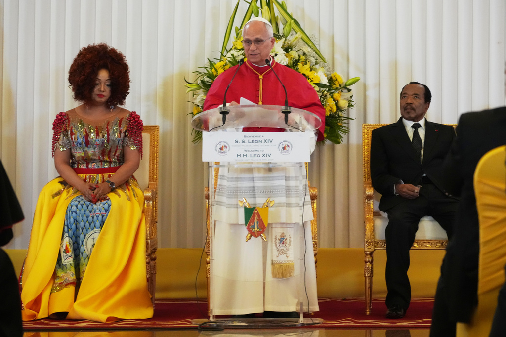 Pope Leo XIV, center, flanked by Cameroon's President Paul Biya and his wife Chantal, meets with the authorities, civil society and the diplomatic corps in Yaounde Cameroon, Wednesday, April 15, 2026. (AP Photo/Andrew Medichini)