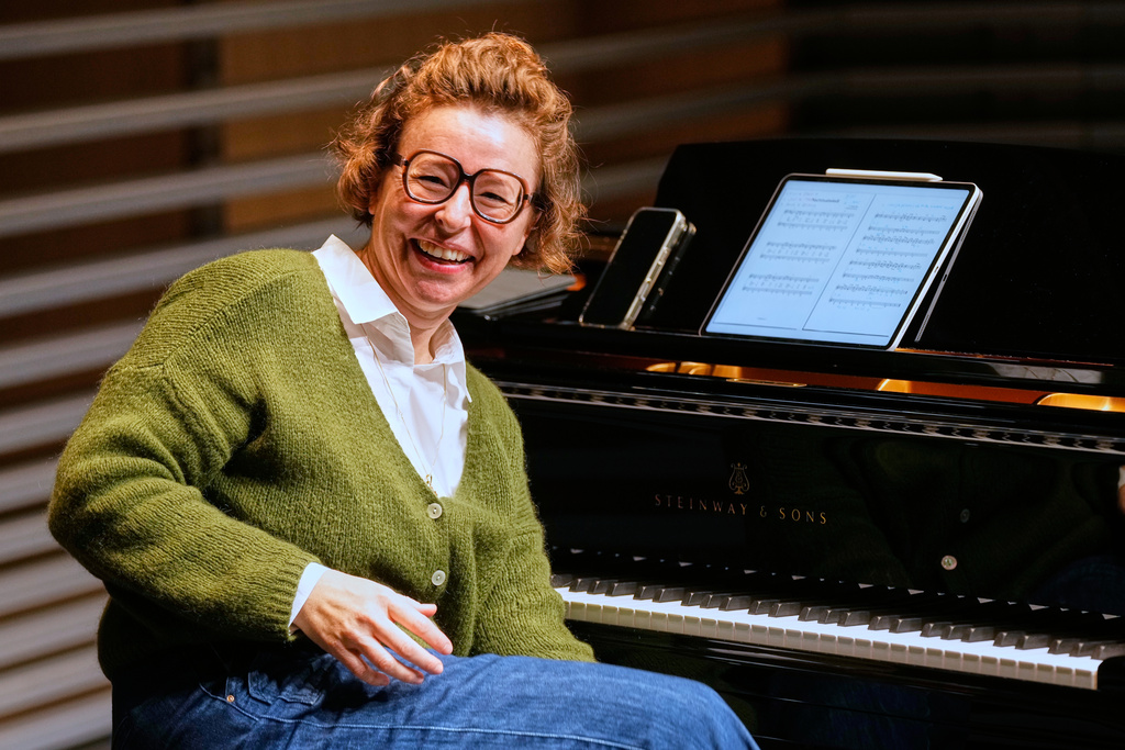 CORRECTS TO RÄSS NOT RAESS - Yodel teacher Nadja Räss laughs at the HSLU university music department in Lucerne, Switzerland, Wednesday, Oct. 29, 2025. (AP Photo/Michael Probst)