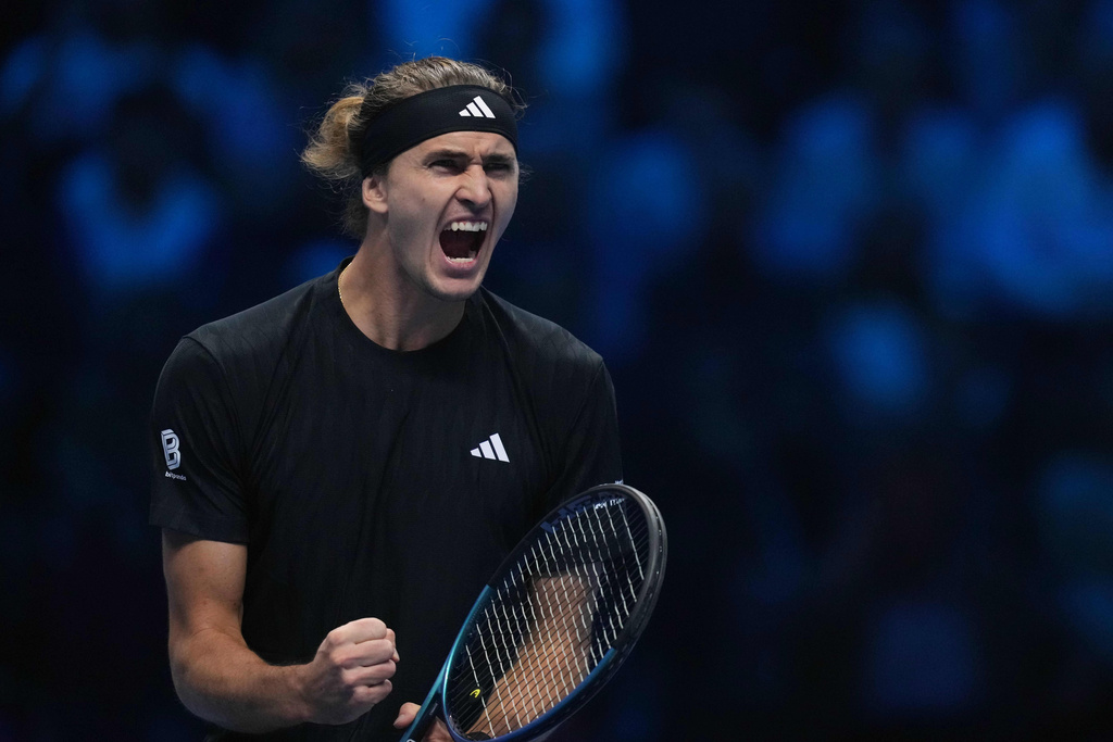 Germany's Alexander Zverev reacts after winning a point against United States' Ben Shelton during their singles tennis match of the ATP World Tour Finals, in Turin, Italy, Sunday, Nov. 9, 2025. (AP Photo/Antonio Calanni)