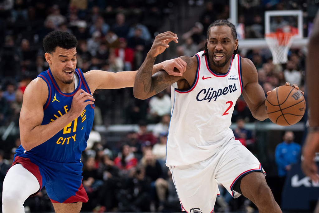 Los Angeles Clippers forward Kawhi Leonard (2) drives to the basket as Denver Nuggets forward Spencer Jones (21) defends during the first half of an NBA basketball game Thursday, Feb. 19, 2026, in Inglewood, Calif. (AP Photo/Kyusung Gong)