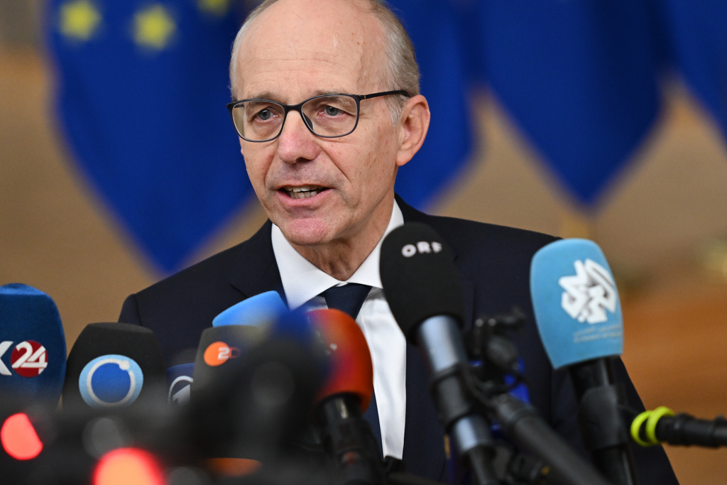 Luxembourg's Prime Minister Luc Frieden speaks with the media as he arrives for an EU Summit at the European Council building in Brussels, Thursday, Oct. 23, 2025. (AP Photo/Harry Nakos)