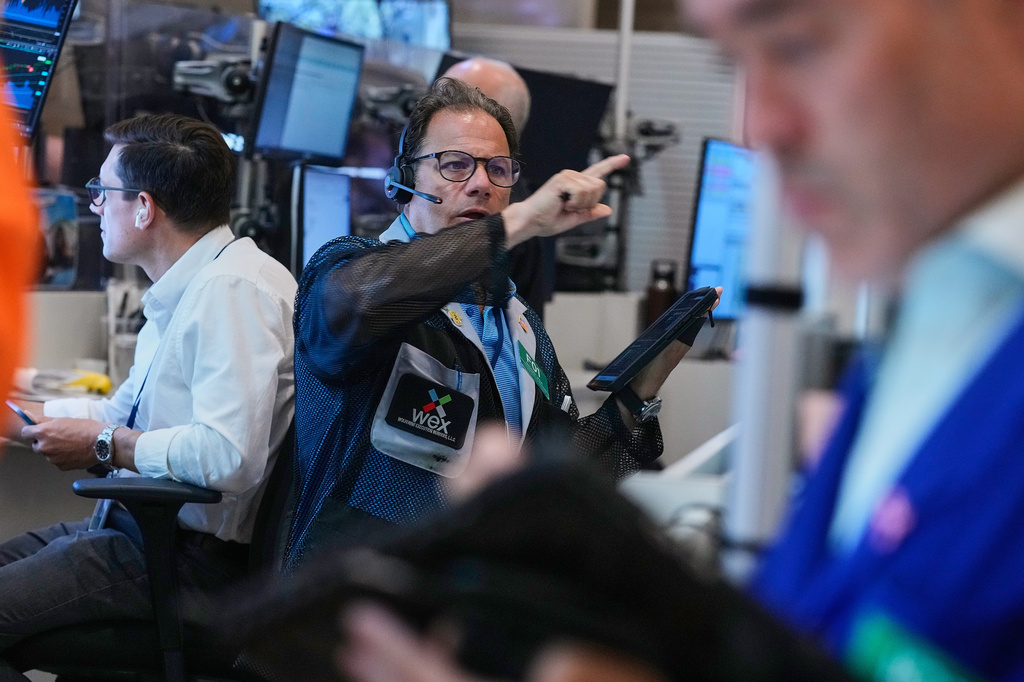 Optons trader Anthony Spina, center, works on the floor of the New York Stock Exchange, Monday, June 15, 2026. (AP Photo/Richard Drew)