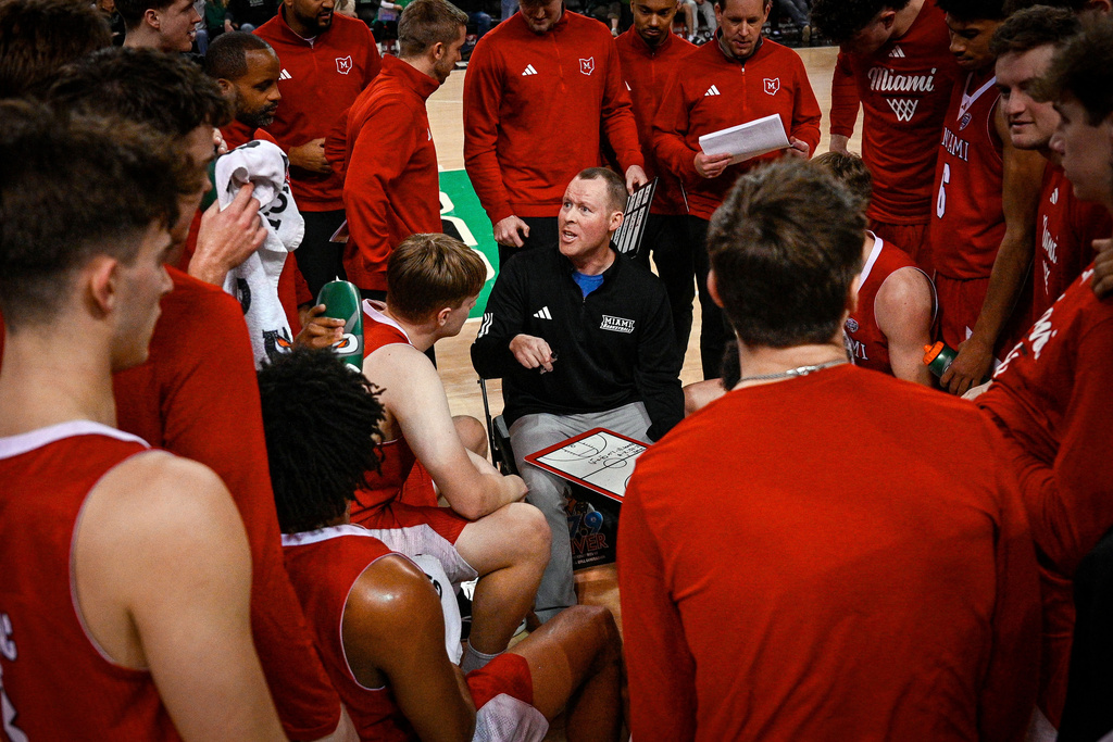 Miami (Ohio) Head Coach Travis Steele talks to his team during the second half of an NCAA college Basketball game against Marshall, Saturday, Feb. 7, 2026, in Huntington, W.Va. (AP Photo/Tyler Evert)
