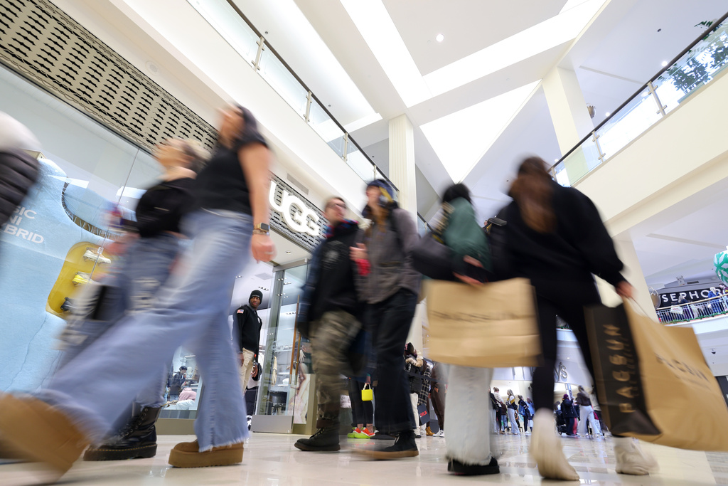 FILE - Shoppers browse through stores at Mall of America for Black Friday deals, Friday, Nov. 28, 2025, in Bloomington, Minn. (AP Photo/Adam Bettcher, File)