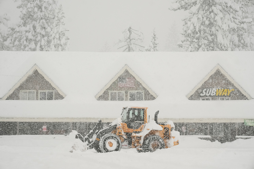Snow is plowed in front of businesses during a snow storm Thursday, Feb. 19, 2026, in Soda Springs, Calif. (AP Photo/Godofredo A. Vásquez)