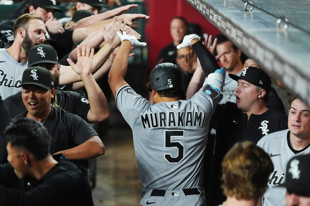 Chicago White Sox's Munetaka Murakami (5), of Japan, celebrates his two-run home run against the Arizona Diamondbacks during the seventh inning of a baseball game, Wednesday, April 22, 2026, in Phoenix. (AP Photo/Ross D. Franklin)