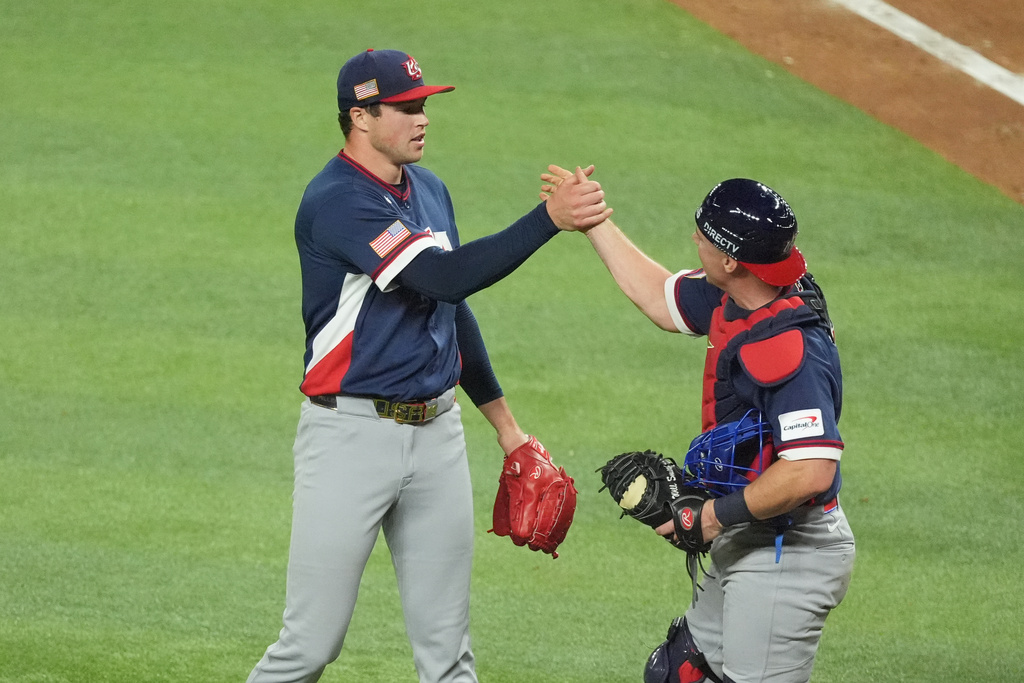 United States pitcher Mason Miller and catcher Will Smith celebrate at the end of the ninth inning during a World Baseball Classic semifinal game against the Dominican Republic, Sunday, March 15, 2026, in Miami. (AP Photo/Rebecca Blackwell)