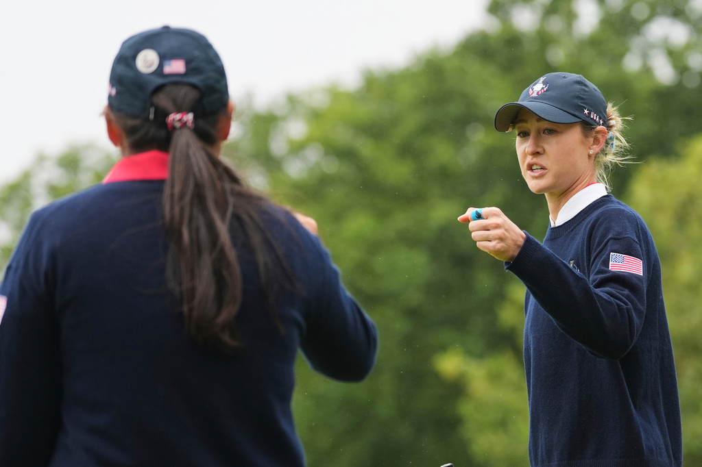 Nelly Korda, right, of the United States gestures to teammate Allisen Corpuz after winning the 13th hole during the Solheim Cup at the Bernardus Golf course in Den Bosch, Netherlands, Friday, Sept. 11, 2026. (AP Photo/Alastair Grant)