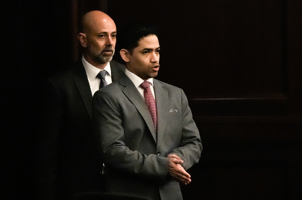 Defense Attorney James Hill, left walks in his client, defendant Mario Fernandez Saldana, during his trial on Tuesday, Aug. 25, 2026 at the Duval Count Courthouse in Jacksonville, Fla. [Doug Engle/The Florida Times-Union via AP, Pool)