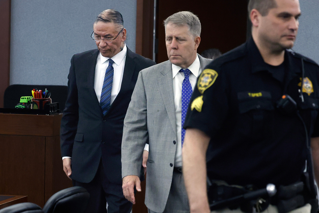 Nathan Chasing Horse, left, and his attorney Craig Mueller enter a courtroom during his sexual assault trial at the Regional Justice Center on Friday, Jan 30, 2026, in Las Vegas. (Bizuayehu Tesfaye/Las Vegas Review-Journal via AP)