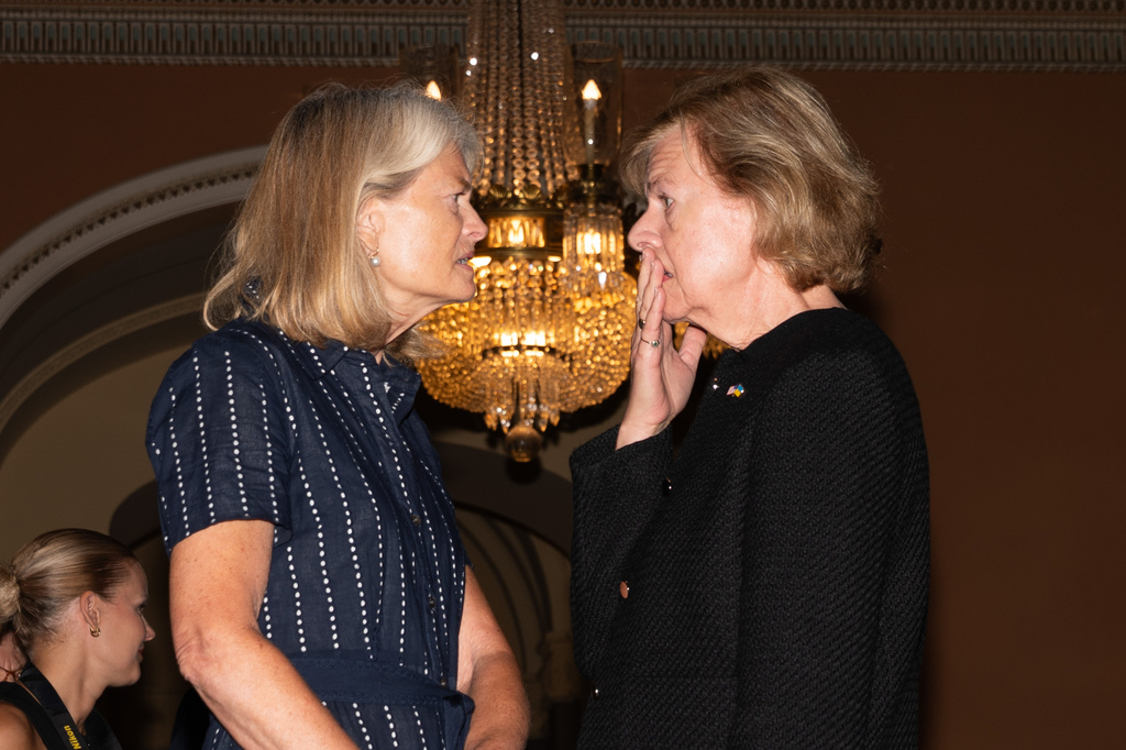 Sen. Lisa Murkowski, R-Alaksa, talks with Sen. Tammy Baldwin, D-Wis., at the U.S. Capitol, Tuesday, July 28, 2026, in Washington. (AP Photo/Allison Robbert)