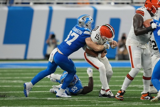 Cleveland Browns quarterback Joe Flacco (15) is sacked by Detroit Lions defensive end Aidan Hutchinson (97) during the second half of an NFL football game, Sunday, Sept. 28, 2025, in Detroit. (AP Photo/Paul Sancya) Cleveland Browns quarterback Joe Flacco (15) is sacked by Detroit Lions defensive end Aidan Hutchinson (97) during the second half of an NFL football game, Sunday, Sept. 28, 2025, in Detroit. (AP Photo/Paul Sancya)
