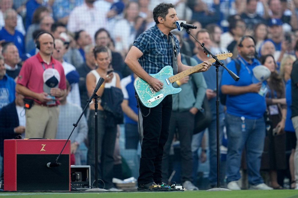 Recording artist Brad Paisley perform the national anthem prior to Game 3 of baseball's World Series between the Toronto Blue Jays and the Los Angeles Dodgers, Monday, Oct. 27, 2025, in Los Angeles. (AP Photo/Ashley Landis)