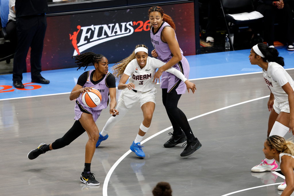 Golden State Valkyries guard Tiffany Hayes (15) moves while ball while being guarded by Atlanta Dream guard Jordin Canada (3) during the first half of the Game 4 of the WNBA Finals between Atlanta Dream and Golden State Valkyries at State Farm Arena in Atlanta on Saturday, Oct. 24, 2026./San Francisco Chronicle via AP)