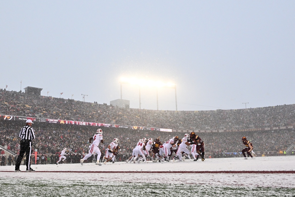 Wisconsin and Minnesota face off during the first half of an NCAA college football game against Saturday, Nov. 29, 2025, in Minneapolis. (AP Photo/Tom Baker)