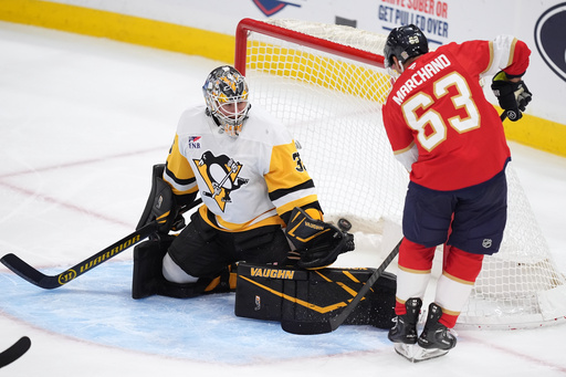 Florida Panthers left wing Brad Marchand (63) scores his team's first goal past Pittsburgh Penguins goaltender Tristan Jarry (35) during the second period of an NHL hockey game, Thursday, Oct. 23, 2025, in Sunrise, Fla. (AP Photo/Rebecca Blackwell) Florida Panthers left wing Brad Marchand (63) scores his team's first goal past Pittsburgh Penguins goaltender Tristan Jarry (35) during the second period of an NHL hockey game, Thursday, Oct. 23, 2025, in Sunrise, Fla. (AP Photo/Rebecca Blackwell)