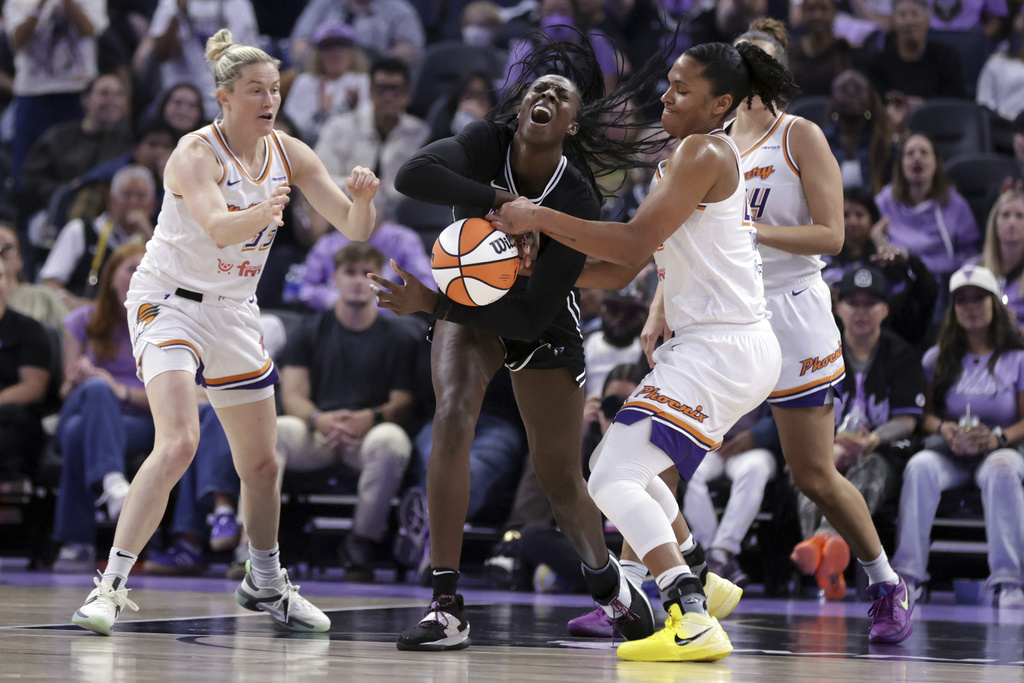 Golden State Valkyries' Laeticia Amihere, center, is fouled by Phoenix Mercury's Alyssa Thomas, center right, during the first half of a WNBA basketball game in San Francisco on Tuesday, Aug. 19, 2025. (Scott Strazzante/San Francisco Chronicle via AP)