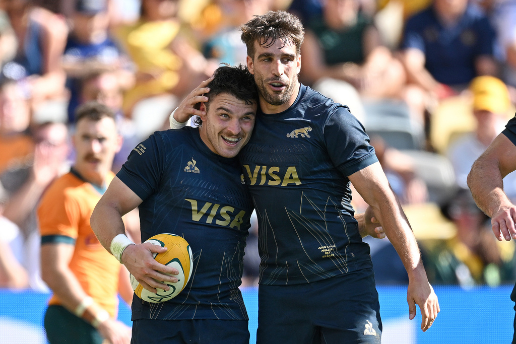 Mateo Carreras, left, of the Pumas is congratulated by a teammate after scoring a try during the rugby international between Australia and Argentina in Townsville, Australia, Saturday, Sept. 6, 2025. (Dave Hunt/AAP Image via AP)