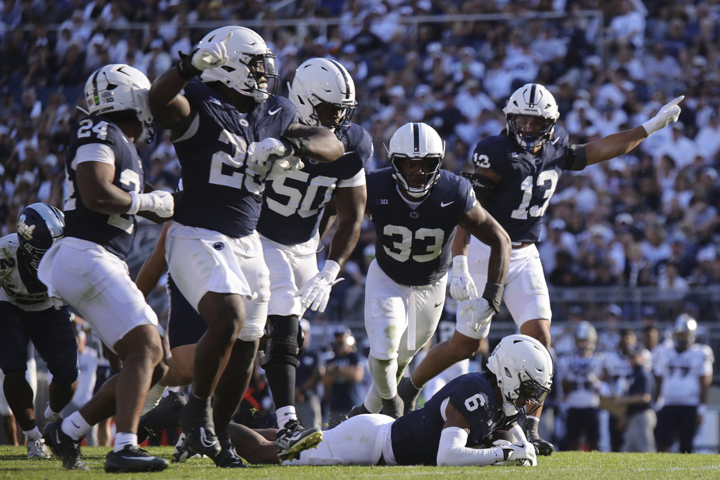 Penn State safety Zakee Wheatley (6) recovers a fumble from Nevada running back Herschel Turner (2) during the third quarter of an NCAA college football game, Saturday, Aug. 30, 2025, in State College, Pa. (AP Photo/Jared Freed)