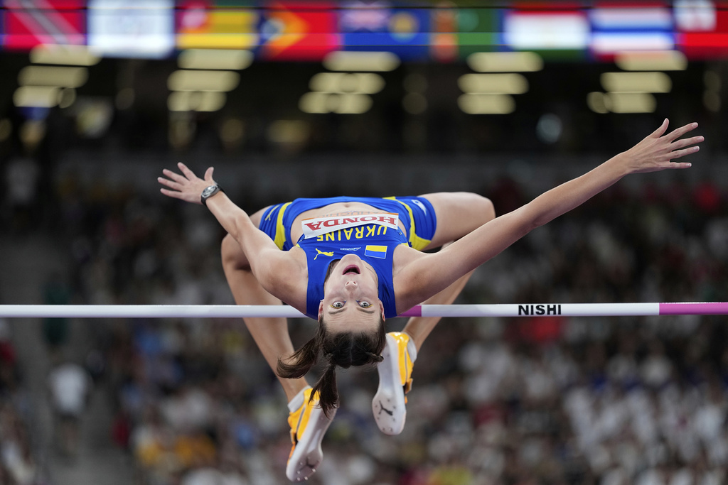 Ukraine's Yaroslava Mahuchikh makes an attempt in the women's high jump qualification at the World Athletics Championships in Tokyo, Thursday, Sept. 18, 2025. (AP Photo/Matthias Schrader)