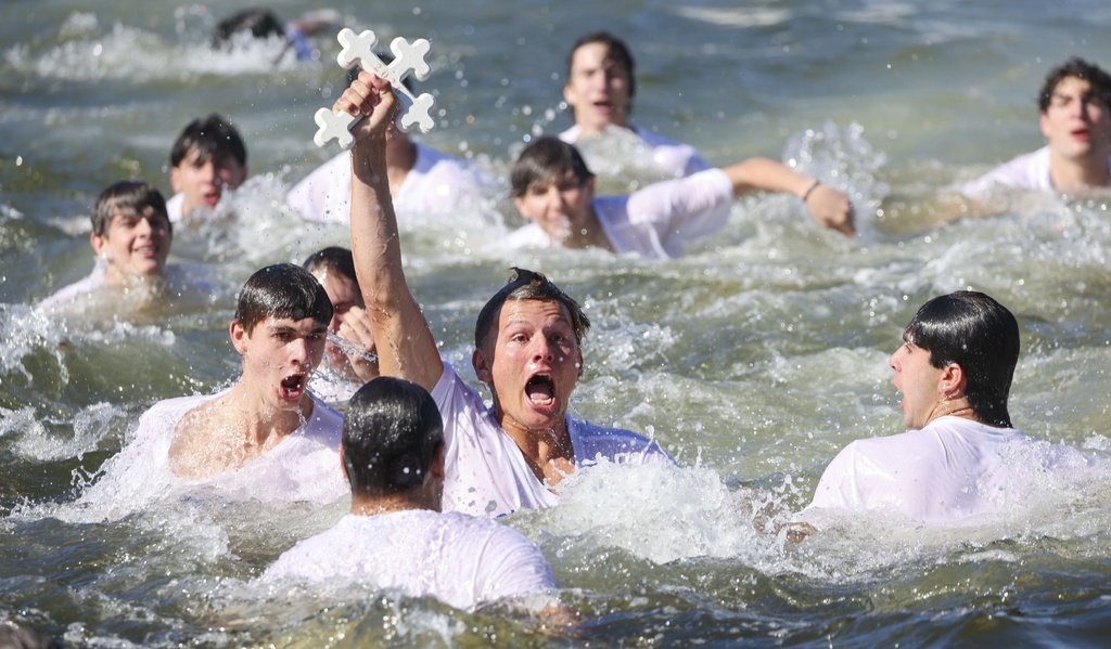 Athos Karistinos, 18, of Tarpon Springs, retrieves the cross from Spring Bayou while participating in the 120th Epiphany celebration on Tuesday, Jan 6, 2026, in Tarpon Springs, Fla. (Jefferee Woo /Tampa Bay Times via AP)