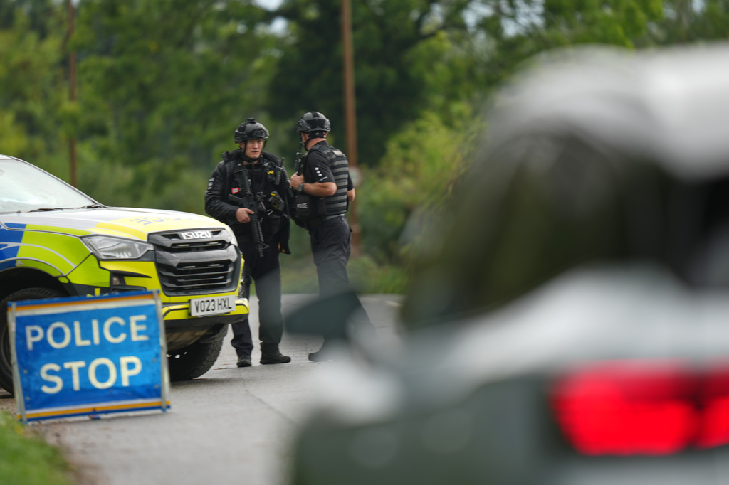 Police guard a road leading to RAF Fairford, a US Airbase, after an incident in Fairford, England , Sunday, Sept. 27, 2026. (AP Photo/Alastair Grant)