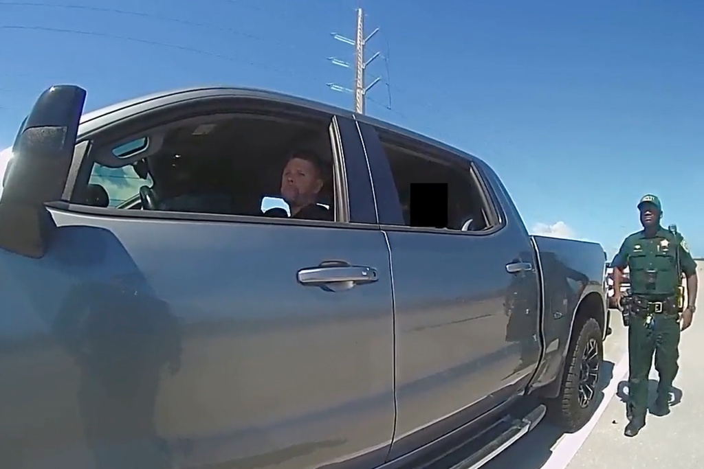 In this screengrab made from body camera footage provided by the Monroe County, Fla., Sheriff's Office, off-duty U.S. Immigration and Customs Enforcement agent Scott Deiseroth argues with a deputy who pulled him over for drunk driving with his children in the car in August 2025. (Monroe County Sheriff's Office via AP)