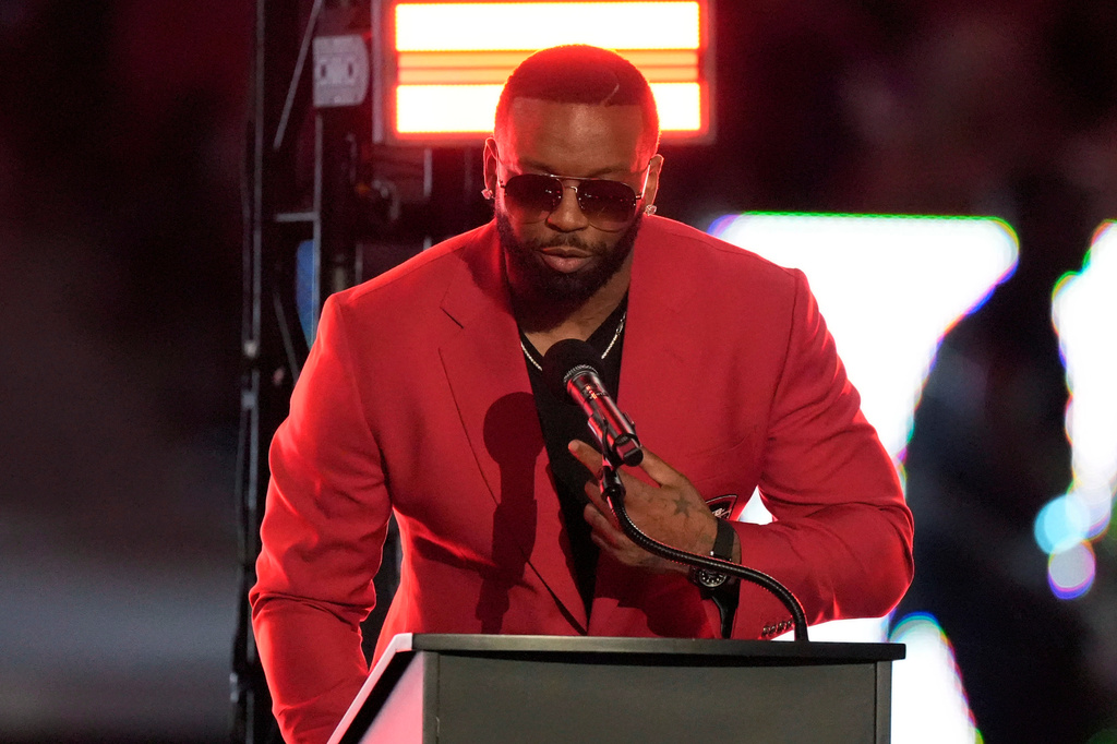 Former Atlanta Falcons defensive end John Abraham speaks during his Ring of Honor Induction Ceremony during halftime of an NFL football game between the Falcons and the Baltimore Ravens, Sunday, Oct. 11, 2026, in Atlanta. (AP Photo/Mike Stewart)