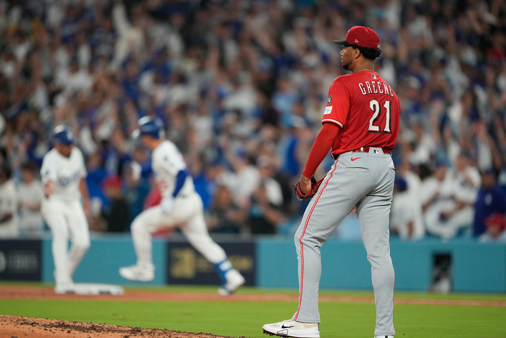 Cincinnati Reds starting pitcher Hunter Greene stands off the mound after giving up a solo home run to Los Angeles Dodgers' Tommy Edman during the third inning in Game 1 of the National League Wild Card baseball playoff series Tuesday, Sept. 30, 2025, in Los Angeles. (AP Photo/Mark J. Terrill)