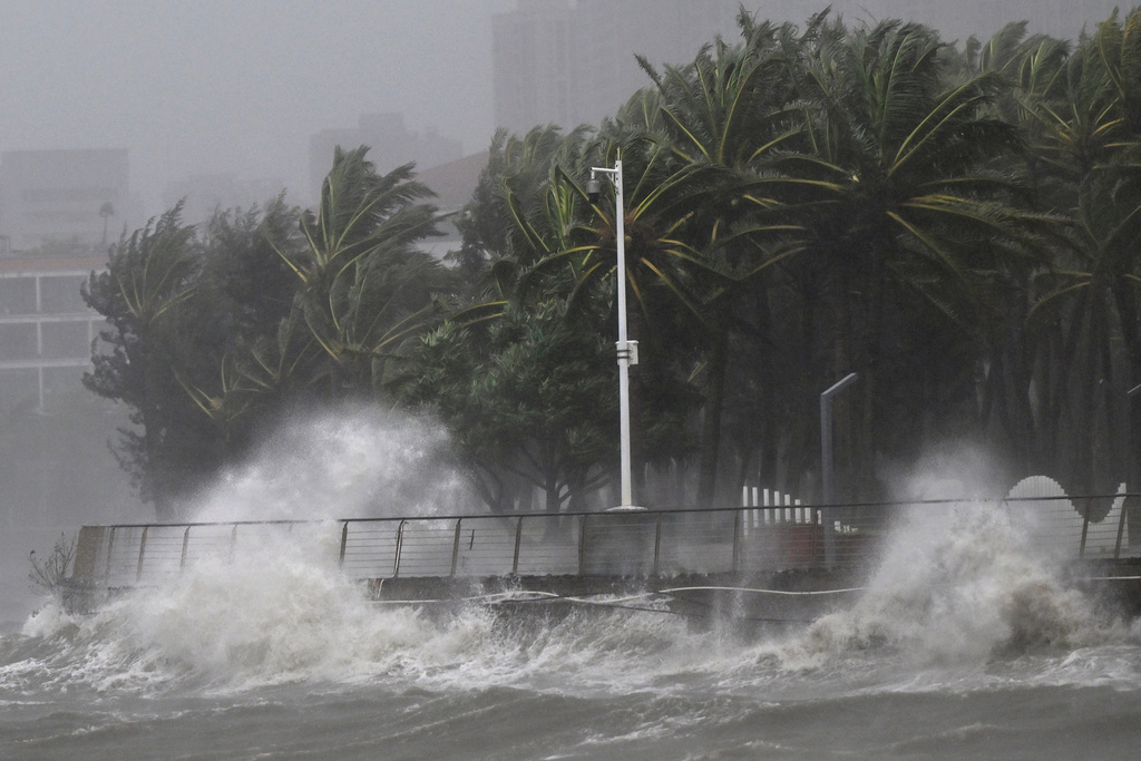 In this photo released by Xinhua News Agency, strong waves are seen ahead of Typhoon Matmo near the coastal downtown area of Haikou, in southern China's Hainan Province on Sunday, Oct. 5, 2025. (Guo Cheng/Xinhua via AP)