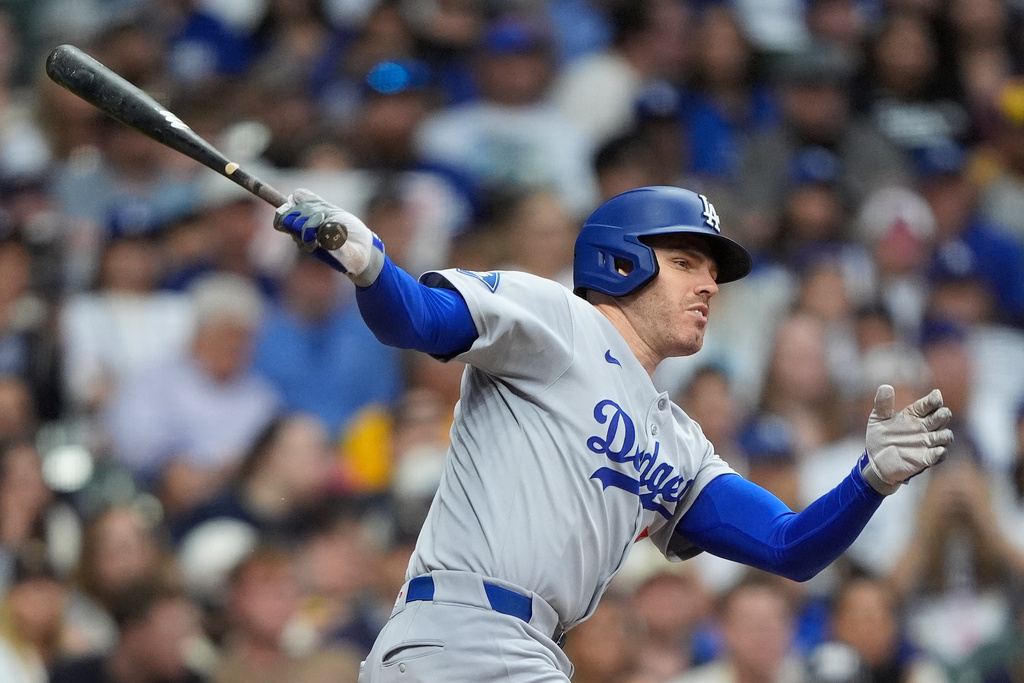 FILE - Los Angeles Dodgers' Freddie Freeman bats during a baseball game against the Milwaukee Brewers, July 7, 2025, in Milwaukee. (AP Photo/Aaron Gash, File)