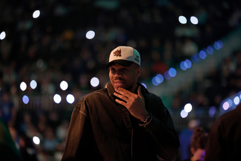 Milwaukee Bucks forward Giannis Antetokounmpo looks on during player introductions before an NBA basketball game against the Dallas Mavericks, Tuesday, March 31, 2026, in Milwaukee. (AP Photo/Jeffrey Phelps)
