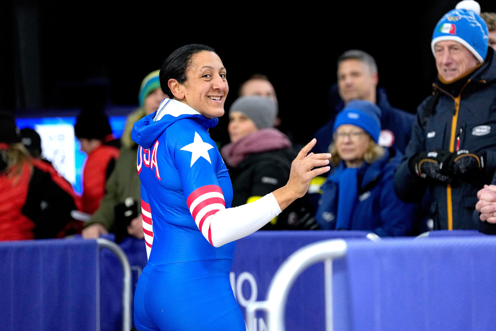 United States' Elana Meyers Taylor, front, smiles at the finish during a two women bobsled run at the 2026 Winter Olympics, in Cortina d'Ampezzo, Italy, Friday, Feb. 20, 2026. (AP Photo/Alessandra Tarantino)