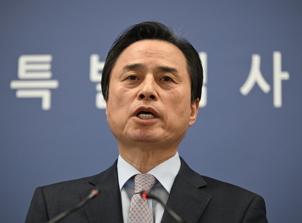 South Korean independent counsel Cho Eun-seok speaks as he announces the results of its investigation into insurrection charges related to former President Yoon Suk Yeol at the Seoul High Prosecutors' Office in Seoul Monday, Dec. 15, 2025. (Jung Yeon-je/Pool Photo via AP)