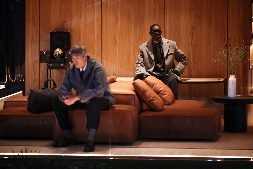 Models wear creations as part of the Louis Vuitton Fall/Winter 2026-2027 Men's collection presented in Paris, Tuesday, Jan. 20, 2026. (AP Photo/Thomas Padilla)