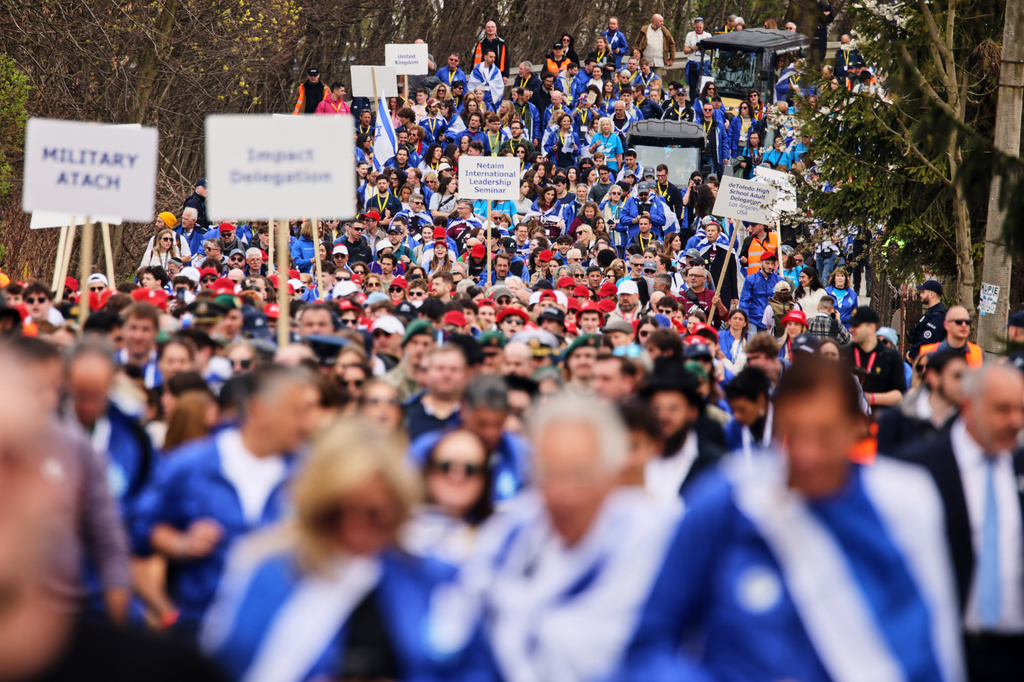 People take part in the annual "March of the Living" to commemorate the Holocaust, a yearly Holocaust remembrance march between the former death camps of Auschwitz and Birkenau, in Oswiecim, Poland, on Tuesday, April 14, 2026. (AP Photo/Beata Zawrzel)