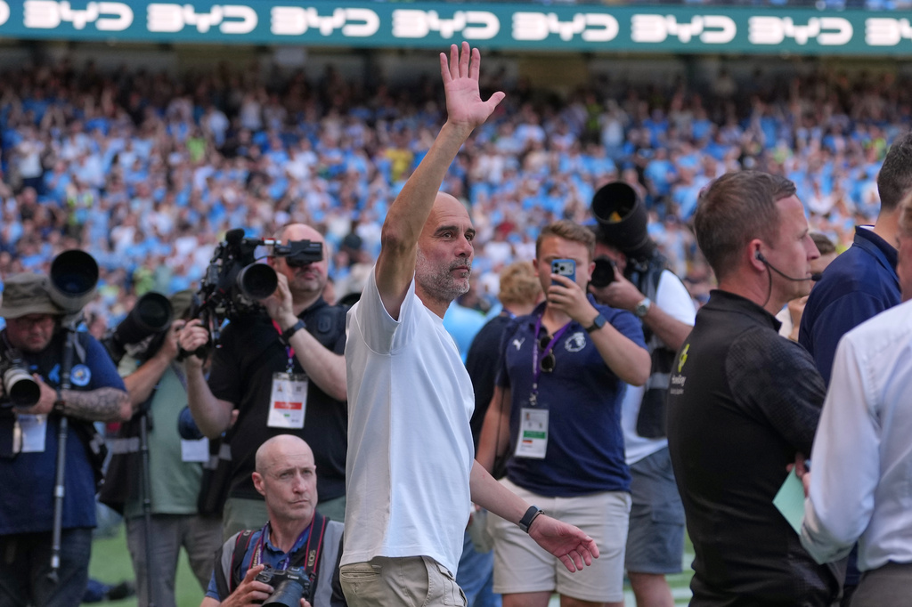 Manchester City's head coach Pep Guardiola waves ahead of his last match as a manager before a Premier League soccer match between Manchester City and Aston Villa in Manchester, England, Sunday, May 24, 2026. (AP Photo/Alastair Grant)