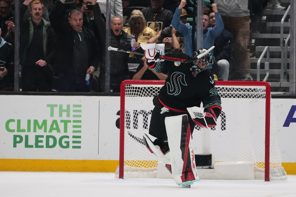 Seattle Kraken goaltender Joey Daccord reacts to making a save against Vegas Golden Knights right wing Pavel Dorofeyev in a shootout for the win in an NHL hockey game Thursday, April 9, 2026, in Seattle. (AP Photo/Lindsey Wasson)