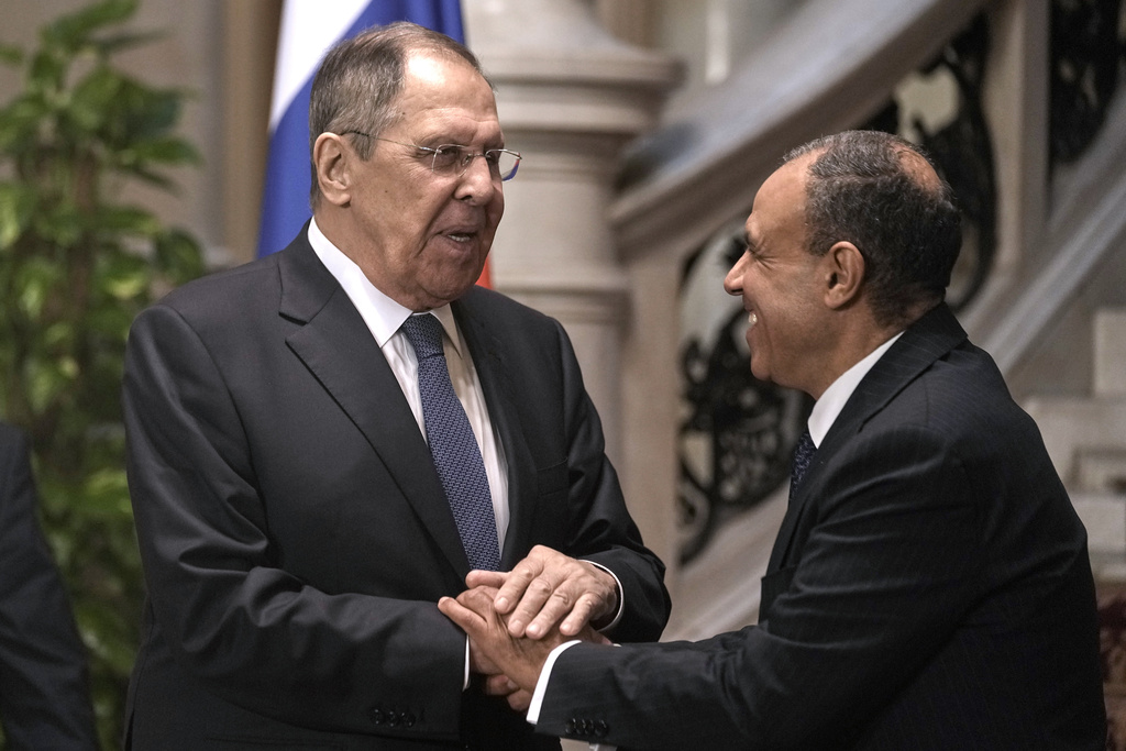 Russian Foreign Minister Sergey Lavrov, left, shakes hands with his Egyptian counterpart Badr Abdelatty, after their joint press conference at Tahrir Palace in Cairo, Egypt, Friday, Dec. 19, 2025. (AP Photo/Amr Nabil)