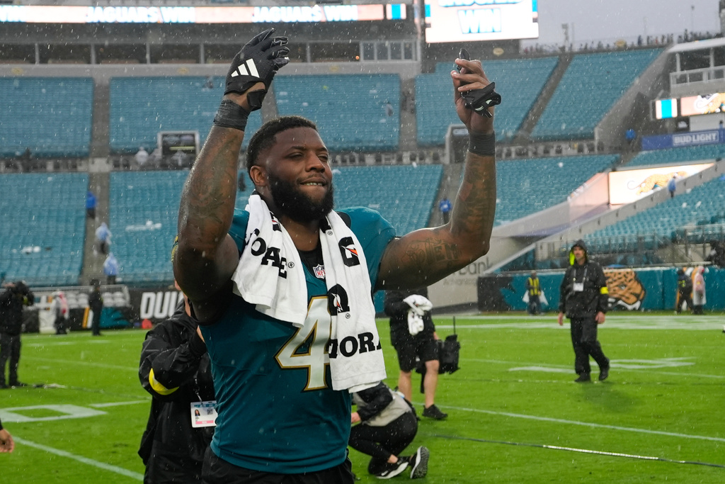 Jacksonville Jaguars defensive end Josh Hines-Allen (41) celebrates as he leaves the field following an NFL football game against the Indianapolis Colts, Sunday, Dec. 7, 2025, in Jacksonville, Fla. (AP Photo/John Raoux)