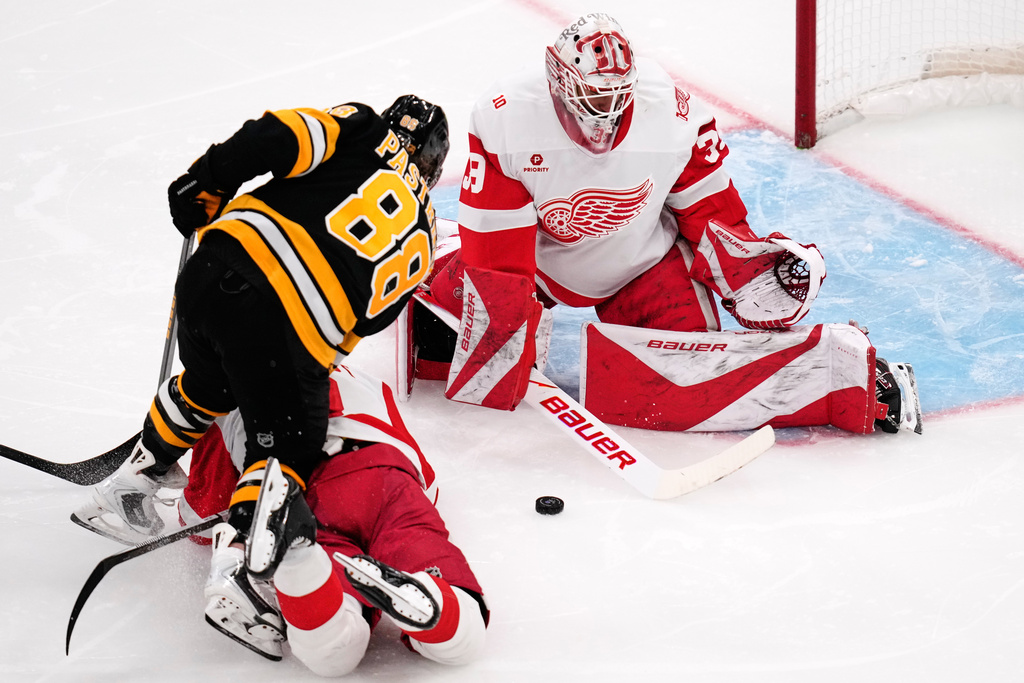 Detroit Red Wings goaltender Cam Talbot makes a save on a shot by Boston Bruins right wing David Pastrnak (88) during the third period of an NHL hockey game, Tuesday, Jan. 13, 2026, in Boston. (AP Photo/Charles Krupa)
